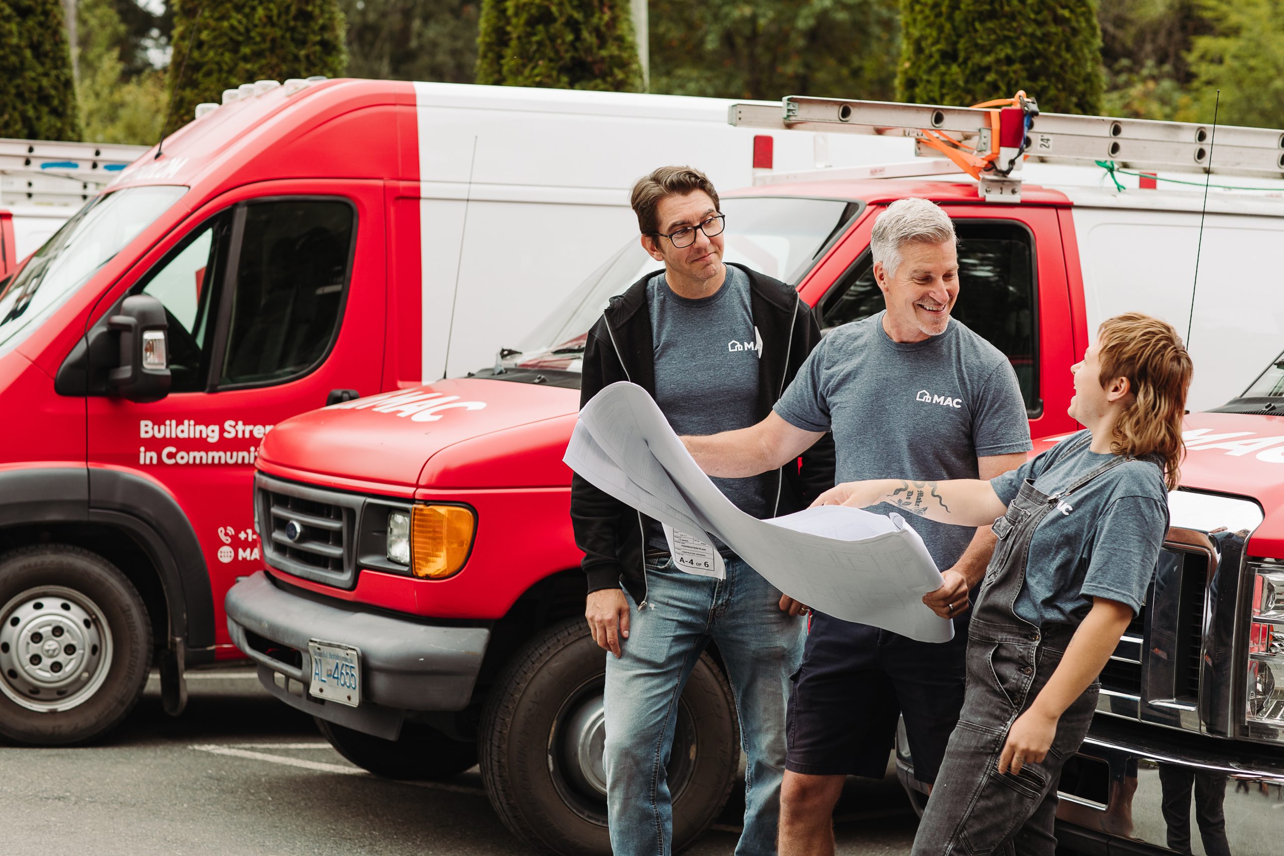 MAC Island Construction team reviewing plans on site as part of coordinated construction services in Victoria.